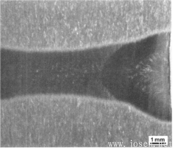 圖1-40 Ti600合金厚板電子束焊縫低倍組織（錐形熔池線清晰可見）.png